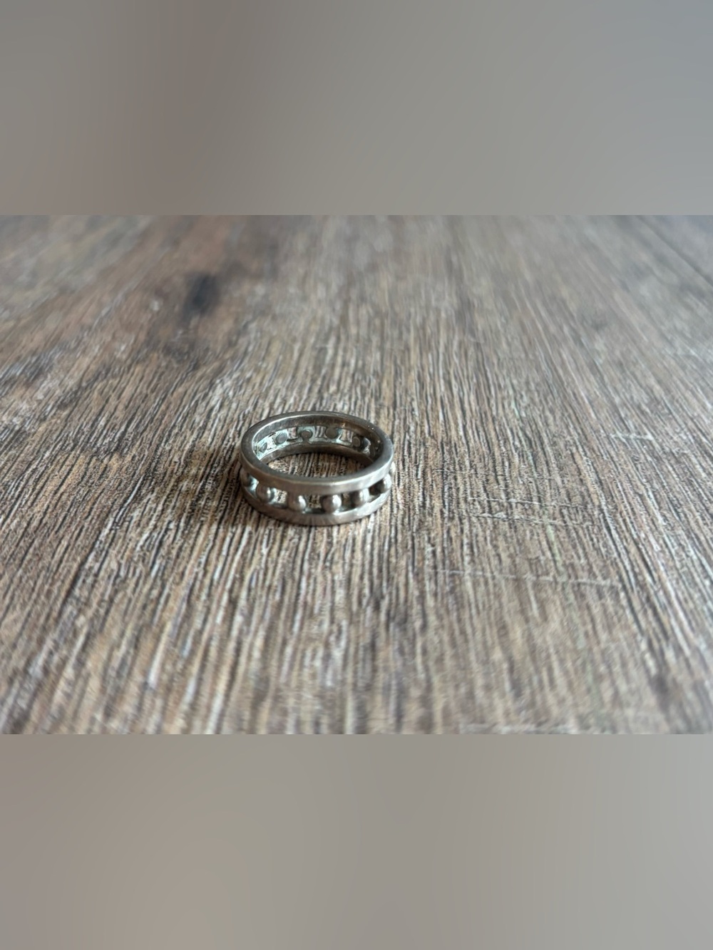 Women’s size 11.5 silver-toned metal ball bearing or studded channel band ring